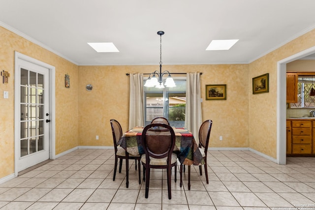 114 Nueces, Seguin, TX 78155 - dining area featuring light tile patterned floors, a skylight, an inviting chandelier, and crown molding