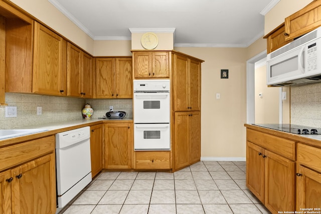 114 Nueces, Seguin, TX 78155 - kitchen featuring tasteful backsplash, white appliances, brown cabinetry, light tile patterned floors, and ornamental molding