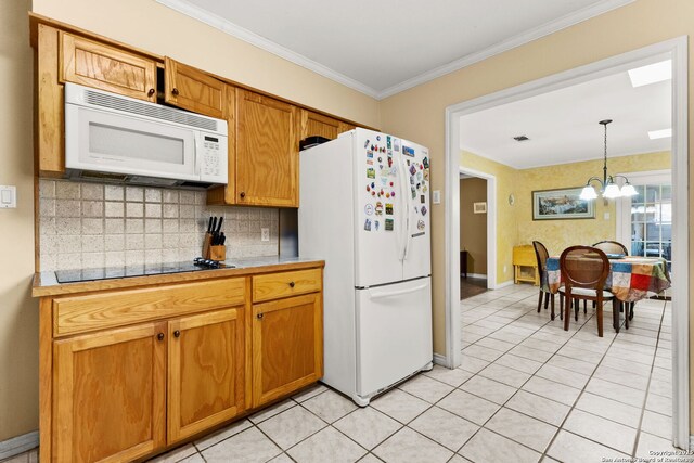 114 Nueces, Seguin, TX 78155 - kitchen with white appliances, an inviting chandelier, decorative backsplash, light countertops, and crown molding