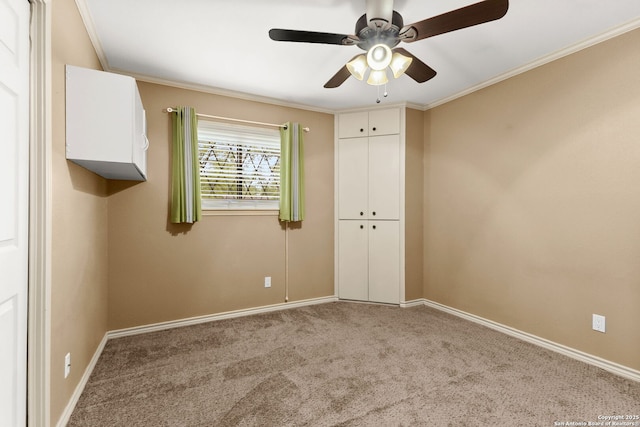 114 Nueces, Seguin, TX 78155 - unfurnished bedroom featuring baseboards, a ceiling fan, carpet floors, and crown molding