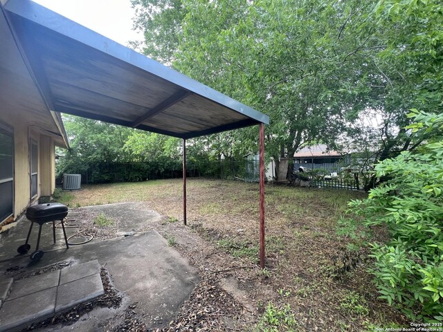 7322 Goya, San Antonio, TX 78239 - view of yard featuring cooling unit, a fenced backyard, and a patio area