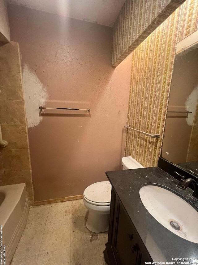 7322 Goya, San Antonio, TX 78239 - bathroom featuring toilet, a tub, wallpapered walls, and vanity