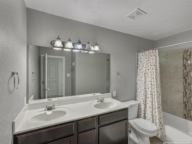 full bath with toilet, a sink, a textured wall, and visible vents