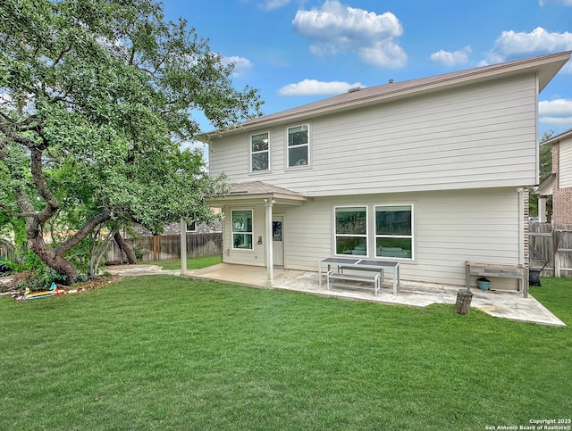 back of property featuring a patio, a fenced backyard, and a lawn