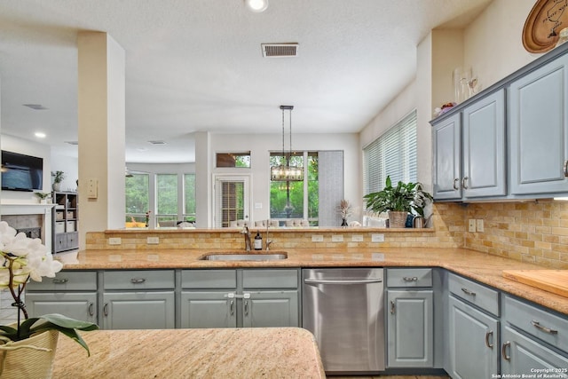 19538 Azure Oak, San Antonio, TX 78258 - kitchen with a sink, gray cabinets, visible vents, backsplash, and dishwasher