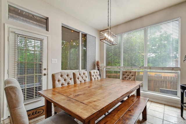 19538 Azure Oak, San Antonio, TX 78258 - dining area with light tile patterned floors, a notable chandelier, and plenty of natural light