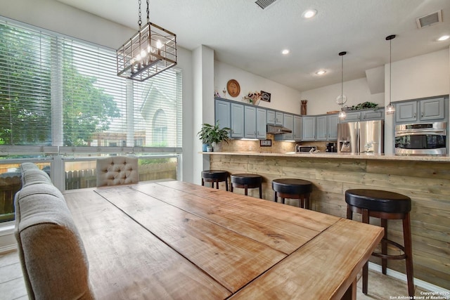19538 Azure Oak, San Antonio, TX 78258 - dining room with a notable chandelier, recessed lighting, and visible vents