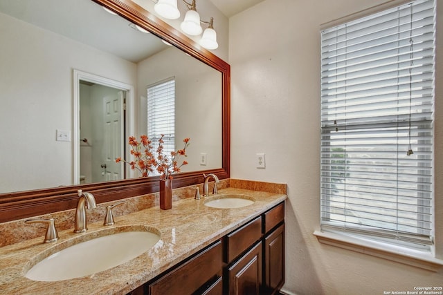 19538 Azure Oak, San Antonio, TX 78258 - bathroom featuring double vanity and a sink