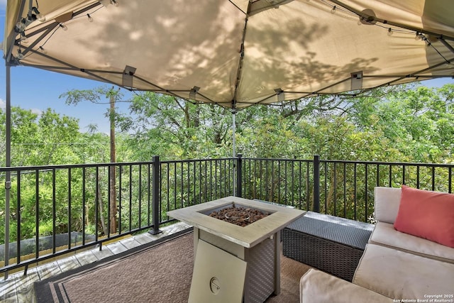 19538 Azure Oak, San Antonio, TX 78258 - view of patio featuring a balcony and an outdoor living space with a fire pit