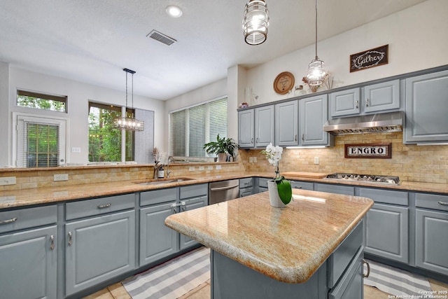 19538 Azure Oak, San Antonio, TX 78258 - kitchen with gray cabinetry, visible vents, stainless steel appliances, and under cabinet range hood