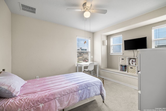 bedroom featuring baseboards, visible vents, a ceiling fan, and carpet floors