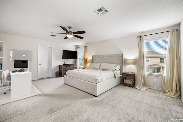 bedroom featuring visible vents, a ceiling fan, and carpet floors