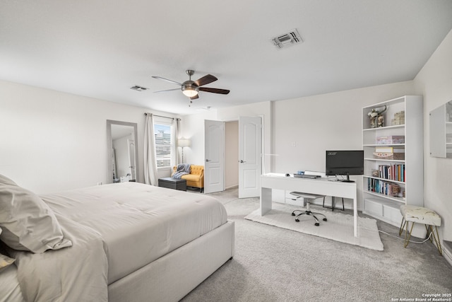 bedroom with carpet, visible vents, and ceiling fan