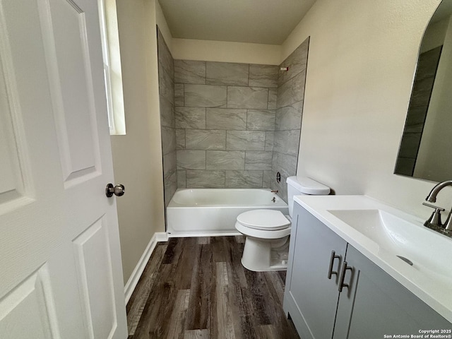 708 E 5th, Nixon, TX 78140 - full bath featuring wood finished floors, toilet,  shower combination, and vanity