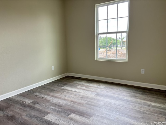 708 E 5th, Nixon, TX 78140 - empty room featuring wood finished floors and baseboards