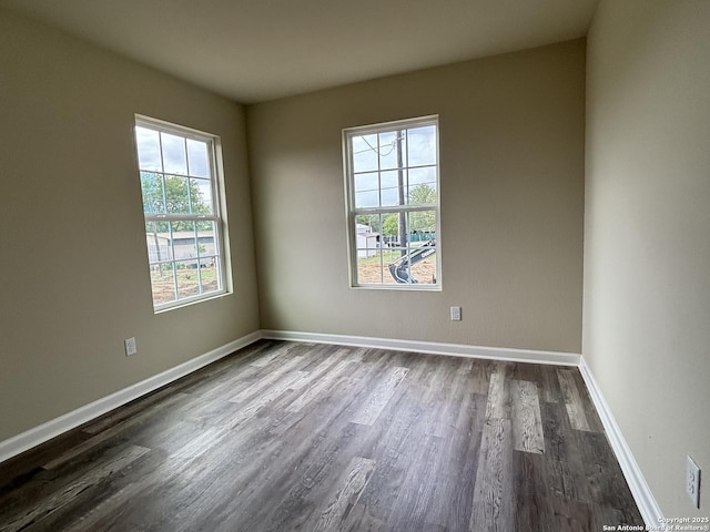 708 E 5th, Nixon, TX 78140 - empty room with dark wood finished floors and baseboards