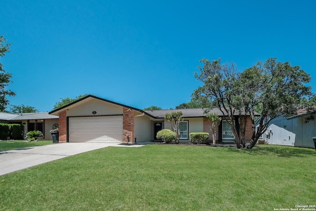 single story home with concrete driveway, a front lawn, an attached garage, and brick siding