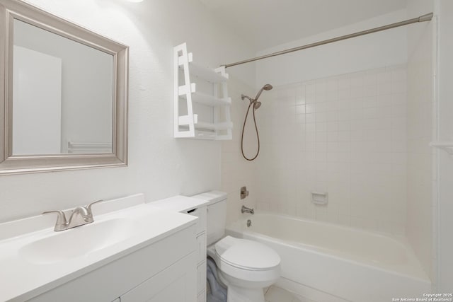 bathroom featuring toilet, washtub / shower combination, and vanity