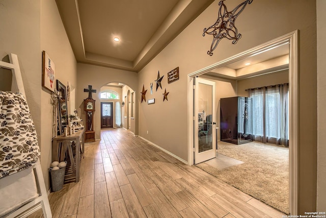 2097 Range Rd, Seguin, TX 78155 - entrance foyer featuring a raised ceiling, wood finished floors, and arched walkways