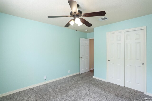 6819 Liberty Stone, San Antonio, TX 78244 - unfurnished bedroom with carpet, a closet, baseboards, and a ceiling fan