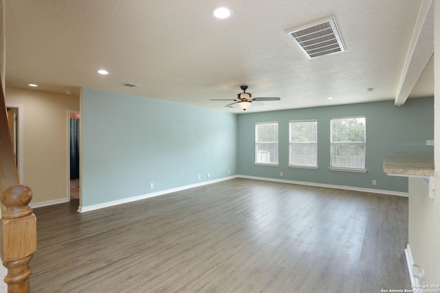 6819 Liberty Stone, San Antonio, TX 78244 - empty room with a ceiling fan, wood finished floors, baseboards, recessed lighting, and a textured ceiling
