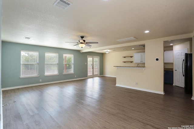 6819 Liberty Stone, San Antonio, TX 78244 - unfurnished living room featuring a ceiling fan, dark wood-style floors, baseboards, plenty of natural light, and recessed lighting