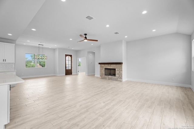 unfurnished living room featuring recessed lighting, a fireplace, ceiling fan, light wood-type flooring, and visible vents