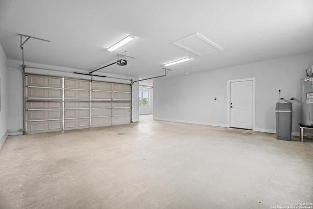 garage featuring a garage door opener, water heater, and baseboards