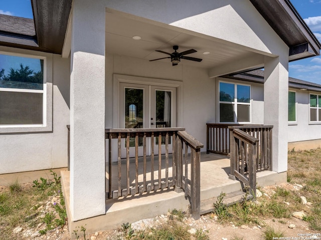 doorway to property featuring a ceiling fan, stucco siding, and french doors