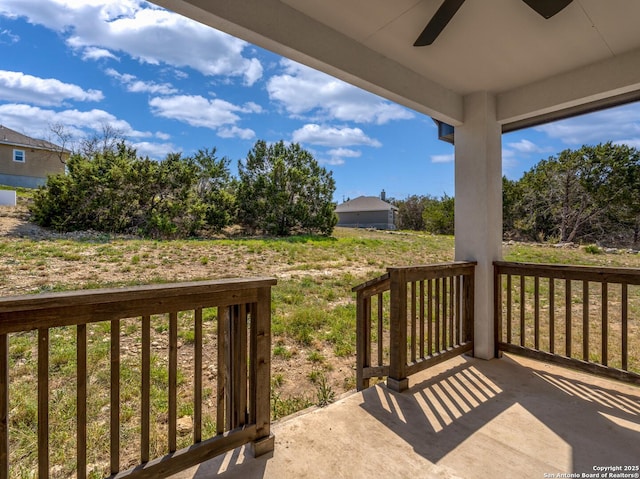 exterior space featuring covered porch and a ceiling fan