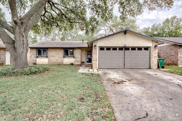 single story home with concrete driveway, a front lawn, an attached garage, and brick siding