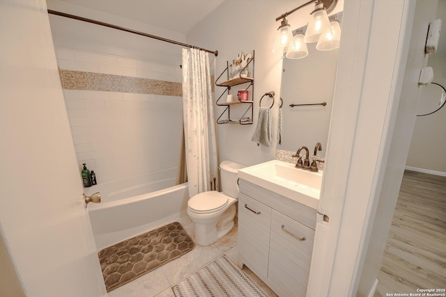 bathroom featuring toilet, tile patterned flooring, shower / bathtub combination with curtain, and vanity