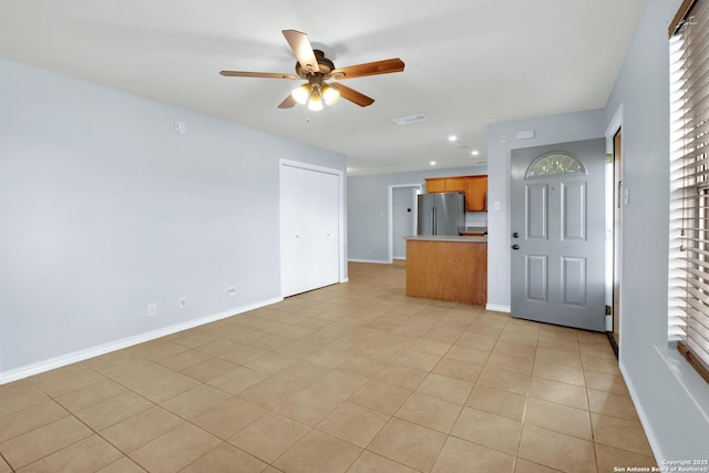 unfurnished living room featuring recessed lighting, a ceiling fan, visible vents, and baseboards