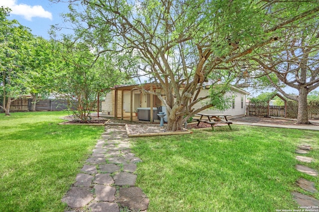 view of yard with a fenced backyard