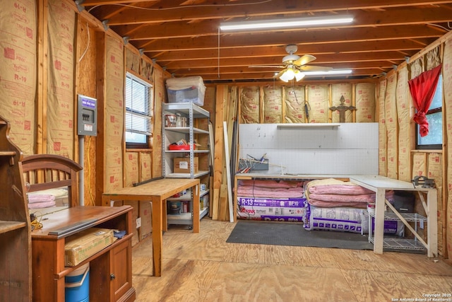 interior space featuring a workshop area and ceiling fan