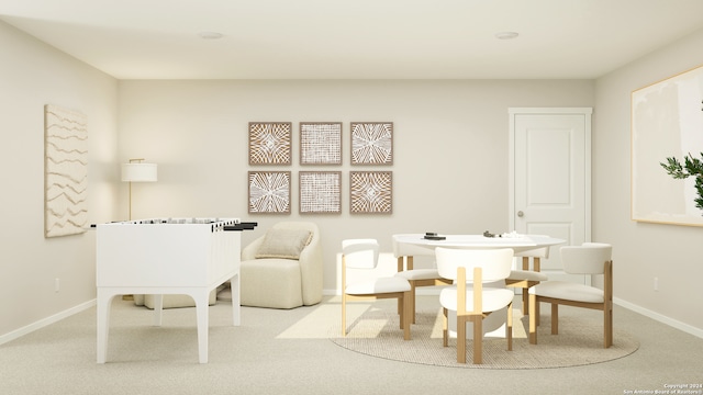 carpeted dining room with baseboards