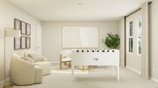 living area with carpet flooring and baseboards