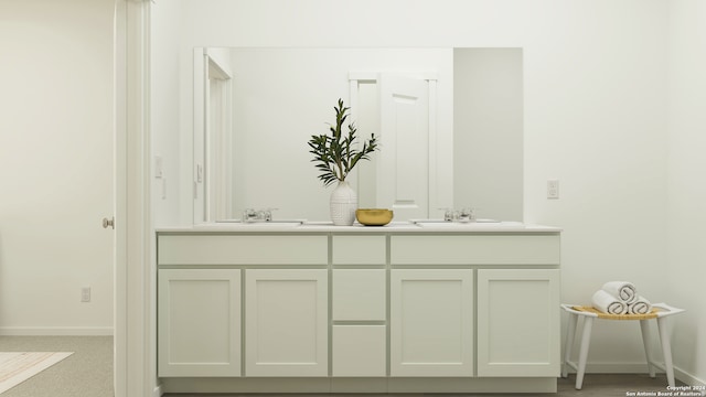 full bath with baseboards, double vanity, and a sink
