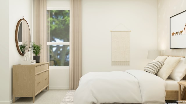 bedroom featuring light carpet and baseboards