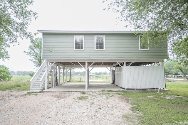 view of front of property with stairway and driveway