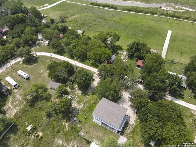 birds eye view of property with a rural view