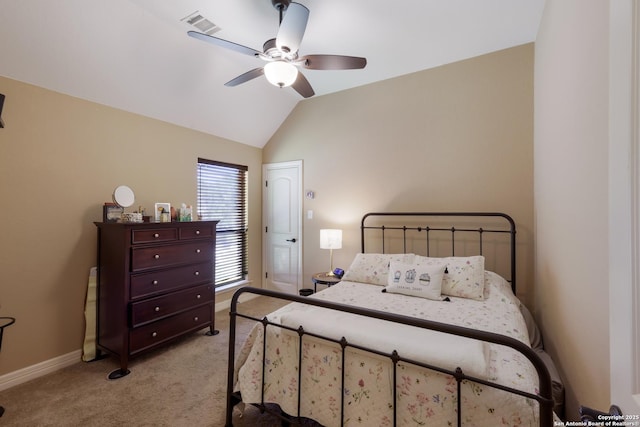 bedroom featuring a ceiling fan, baseboards, vaulted ceiling, and light carpet