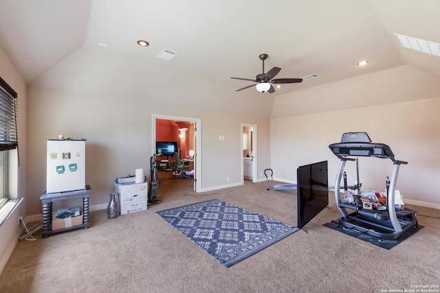 workout area featuring lofted ceiling, visible vents, baseboards, carpet, and a ceiling fan
