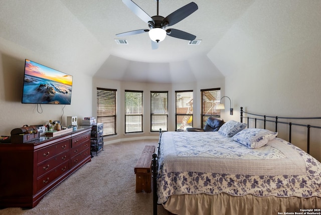 bedroom with visible vents, ceiling fan, lofted ceiling, and carpet