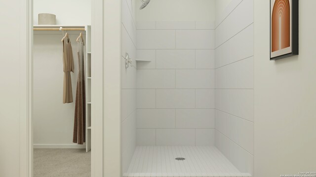 full bath featuring a tile shower