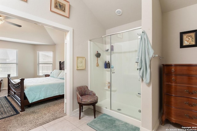 bathroom with tile patterned floors, a stall shower, ensuite bath, and lofted ceiling