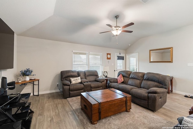 living room with lofted ceiling, wood finished floors, a ceiling fan, and baseboards