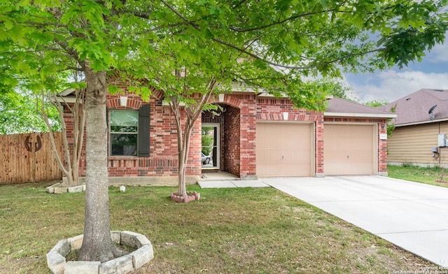 view of property hidden behind natural elements with brick siding, fence, a garage, a front lawn, and concrete driveway
