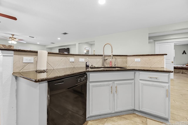 kitchen featuring backsplash, dishwasher, ceiling fan, and a sink