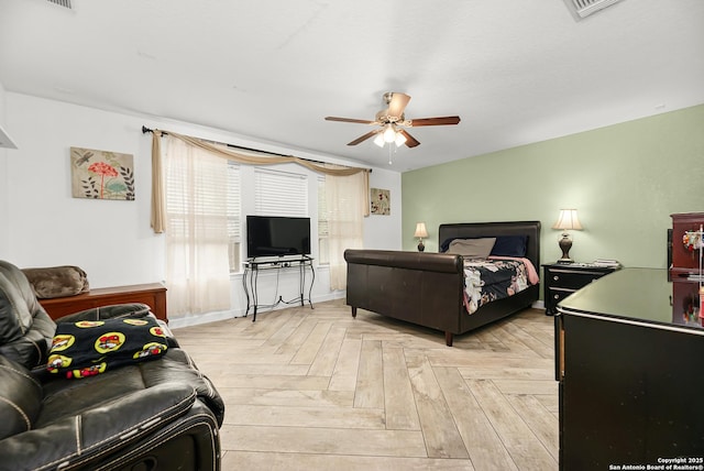 bedroom with ceiling fan, baseboards, and visible vents